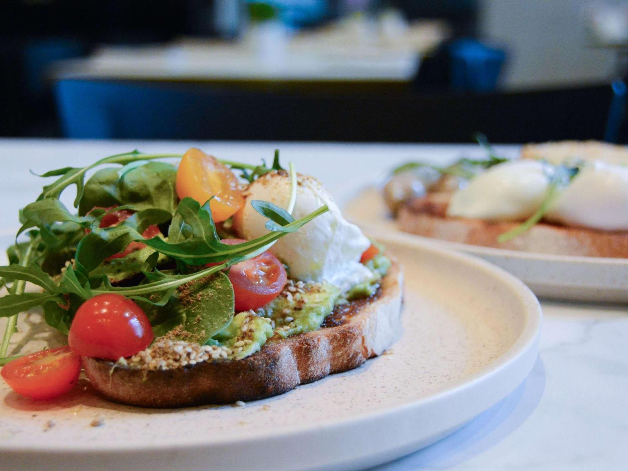 The Como Melbourne Exterior photo Avocado on toast with rocket, cherry tomatoes and goat's cheese